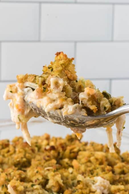 A spoonful of an easy casserole made with chicken, broccoli and stuffing.